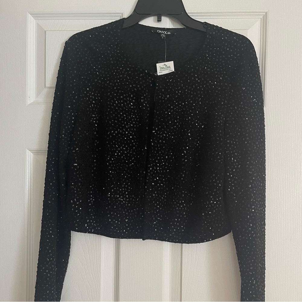 Onyx nite  top. New with tag. Size large .